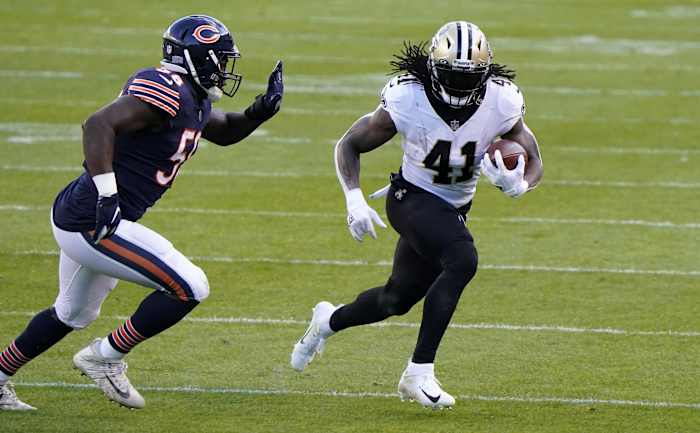 New Orleans Saints running back Alvin Kamara (41) rushes the ball against the Chicago Bears. Mandatory Credit: Mike Dinovo-USA TODAY Sports